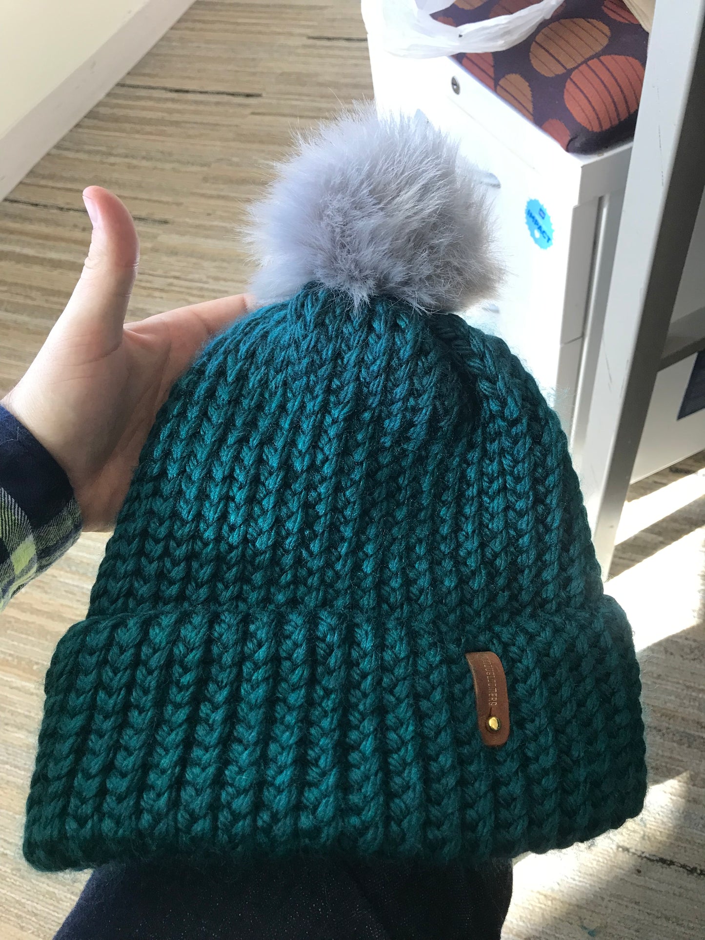 BLUE HAT, WHITE POMPOM WITH ANXIOUSLOOMERS TAG