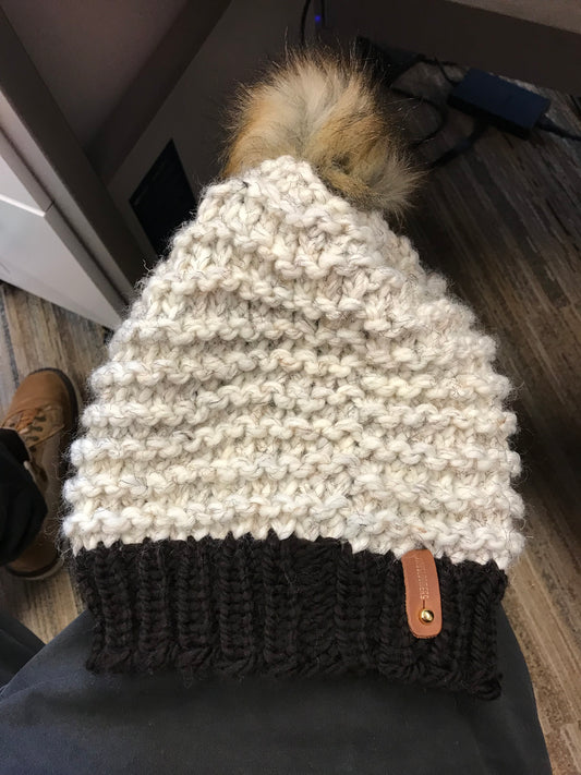 BLACK AND TAN HAT, BROWN POMPOM WITH ANXIOUSLOOMERS TAG