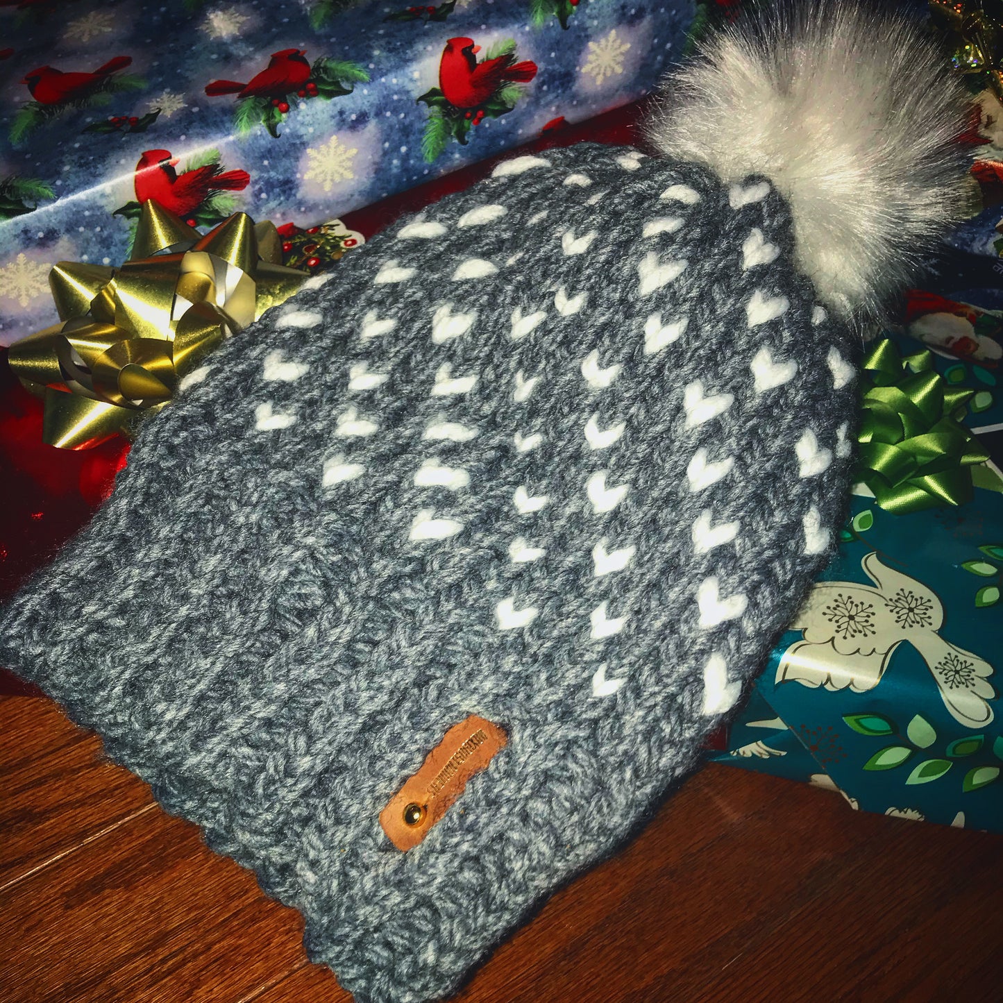 SILVER HAT WITH WHITE HEARTS, WHITE POMPOM WITH ANXIOUSLOOMERS TAG