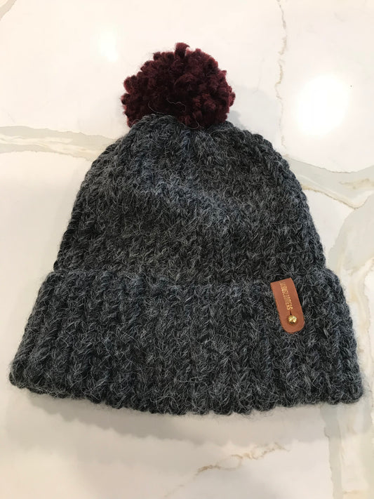 BLACK HAT, RED POMPOM WITH ANXIOUSLOOMERS TAG