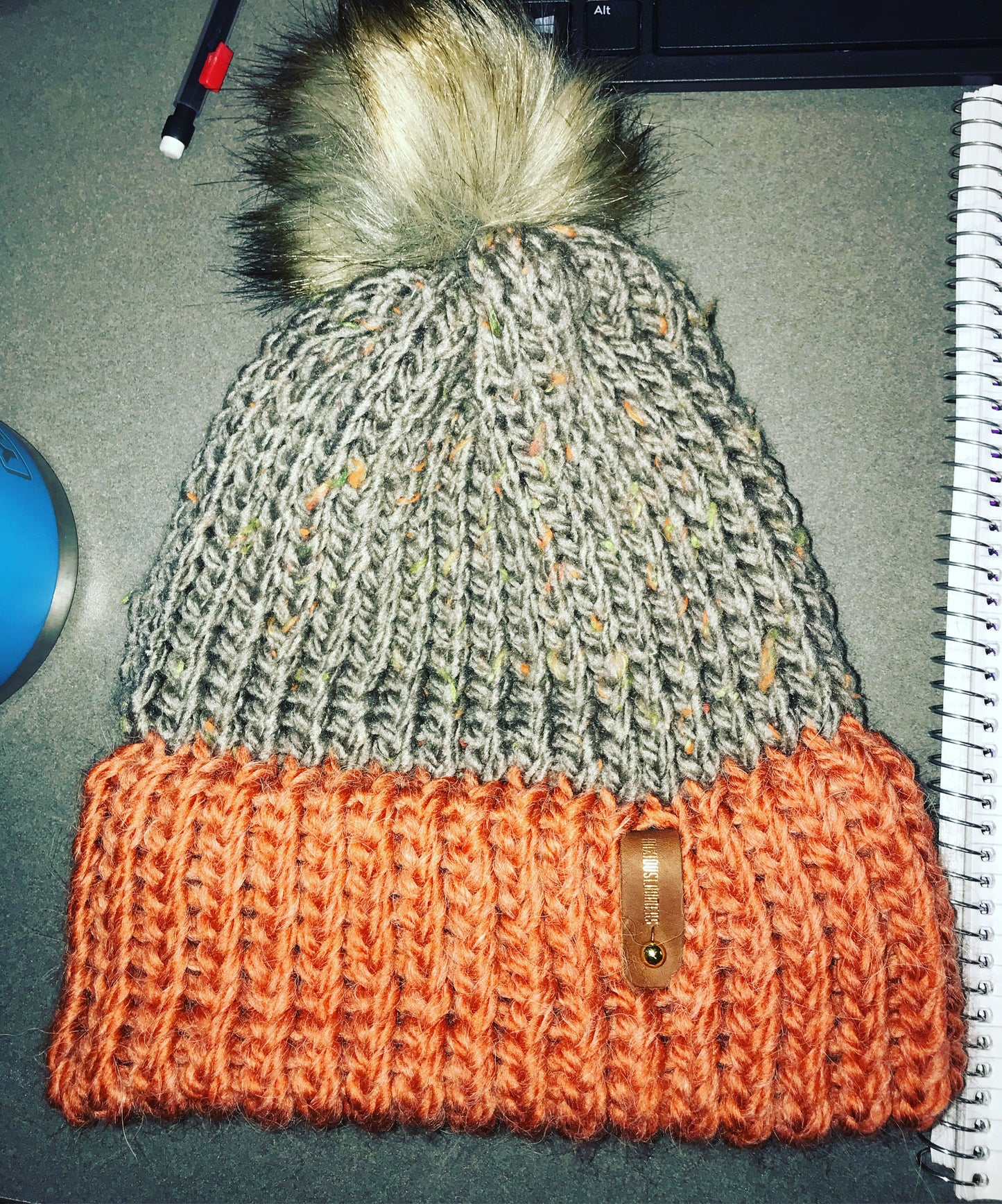 RUST AND SILVER HAT, BROWN POMPOM WITH ANXIOUSLOOMERS TAG