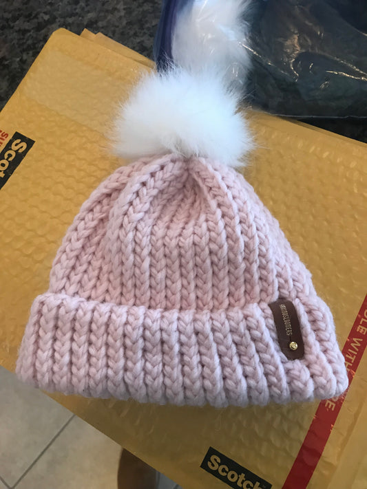 PINK BABY HAT, WHITE POMPOM WITH ANXIOUSLOOMERS TAG