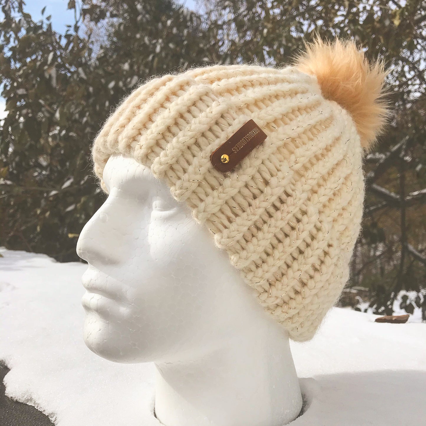 CREAM HAT WITH CREAM POMPOM AND ANXIOUSLOOMER TAG